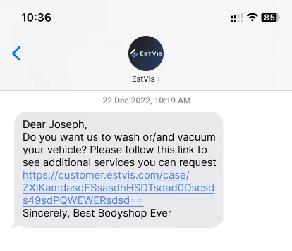 Text message from a bodyshop offering to wash and vacuum the customer's vehicle with a link to the additional services page